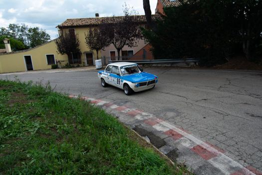 PESARO COLLE SAN BARTOLO , ITALY - OTT 10 - 2021 : BMW 2002 on an old racing car ifor rally
