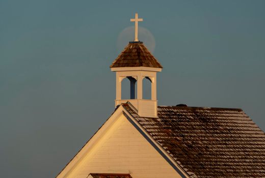 Moon rising over Prairie Country Church Canada