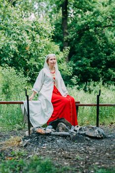 happy woman pagan priestess prepared for the ceremony. old faith in our time. seasons, summer