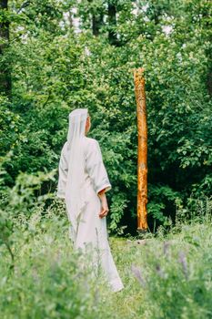 happy woman pagan priestess prepared for the ceremony. old faith in our time. seasons, summer