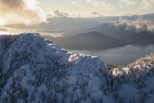 Beautiful landscape view of the snow covered mountains. Picture taken at the Vancouver North Shore, near Howe Sound, BC, Canada.