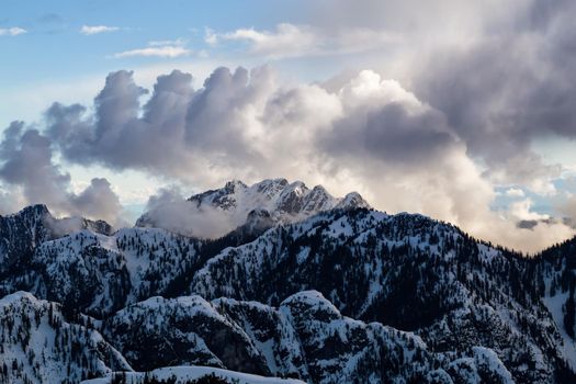 Aerial landscape view of the snow covered mountain range North of Vancouver, British Columbia, Canada.