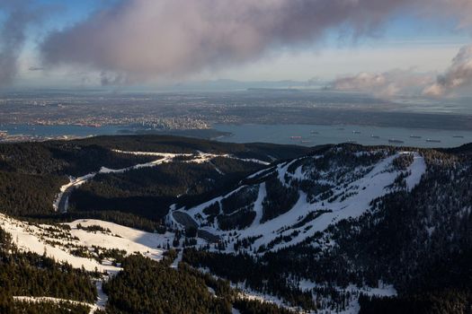 Cypress Mountain from an aerial perspective with Vancouver City, BC, Canada, in the background.