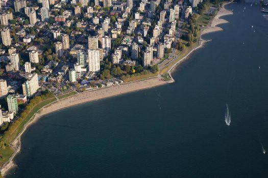 Aerial view on English Bay Beach in Vancouver Downtown, British Columbia, Canada, during a sunny evening.
