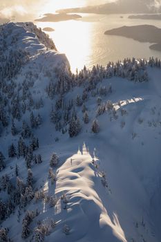 Beautiful landscape view of the snow covered mountains. Picture taken at the Vancouver North Shore, near Howe Sound, BC, Canada.