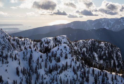 Aerial landscape view of Mt Seymour Provincial Park during a cloudy evening before sunset. Picture taken in Vancouver North Shore Mountains, BC, Canada.