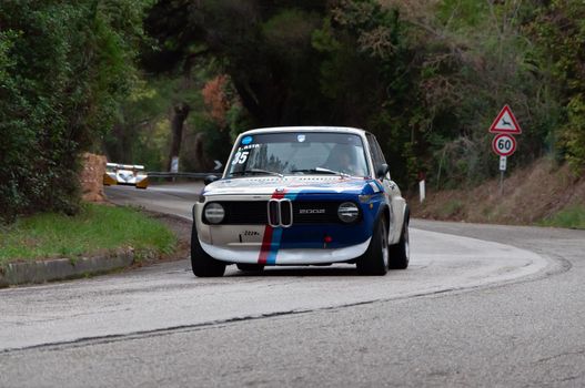 PESARO COLLE SAN BARTOLO , ITALY - OTT 10 - 2021 : BMW 2002 on an old racing car ifor rally