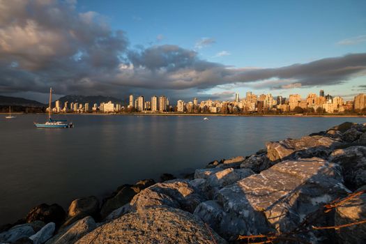 View on Downtown Vancouver during a cloudy winter sunset. Picture taken from Kits Point, British Columbia, Canada.