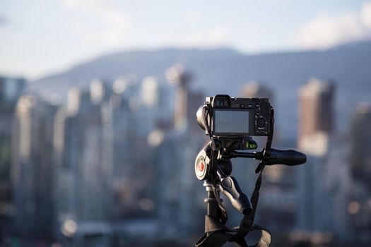 Downtown Vancouver, BC, Canada - Apr 02, 2017 - Sonny Camera A6000 taking a timelapse of the City during Sunset.