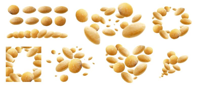 A set of photos. Yellow lentils levitate on a white background.