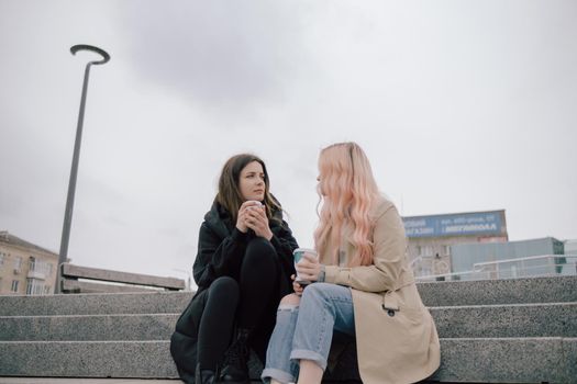 two woman conversation at the street smiling