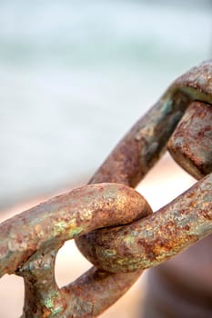 The old and rusted chain. Close up.Vertical view