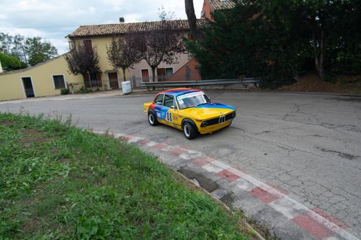 PESARO COLLE SAN BARTOLO , ITALY - OTT 10 - 2021 : BMW 2002 on an old racing car ifor rally