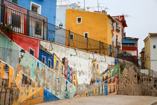 Villajoyosa, Alicante, Spain- April 22, 2022:Beautiful mural on the wall and Old colorful facades in Villajoyosa, Alicante, Spain