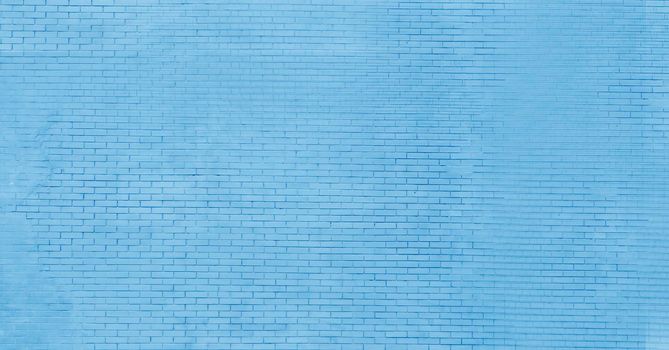 Abstract blue brick wall background. Shabby abandoned wall.