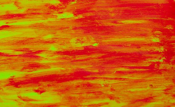 Abstract texture from shades of red and yellow paint.