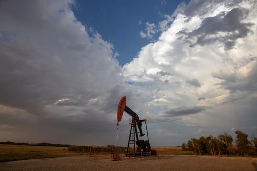 Prairie Storm Clouds Saskatchewan oil pump jack