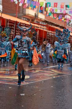 ORURO, BOLIVIA - FEBRUARY 25, 2017: Diablada dancers in ornate costumes parade through the mining city of Oruro on the Altiplano of Bolivia during the annual carnival.