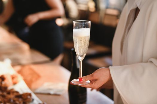 Bride holding a glass of champagne