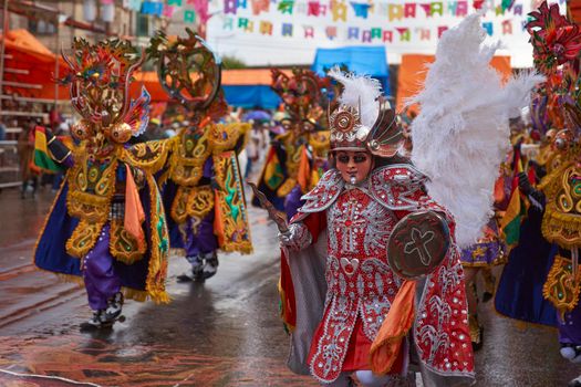 ORURO, BOLIVIA - FEBRUARY 25, 2017: Diablada dancers in ornate costumes parade through the mining city of Oruro on the Altiplano of Bolivia during the annual carnival.