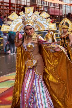 ORURO, BOLIVIA - FEBRUARY 25, 2017: Dancers dressed in ornate Inca style costumes parading through the mining city of Oruro on the Altiplano of Bolivia during the annual carnival.