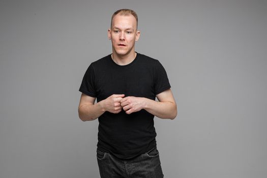picture of handsome caucasian male say something interesting isolated on grey background