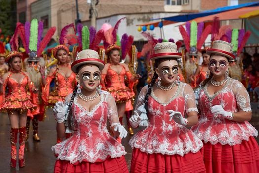 ORURO, BOLIVIA - FEBRUARY 25, 2017: Diablada dancers in ornate costumes parade through the mining city of Oruro on the Altiplano of Bolivia during the annual carnival.