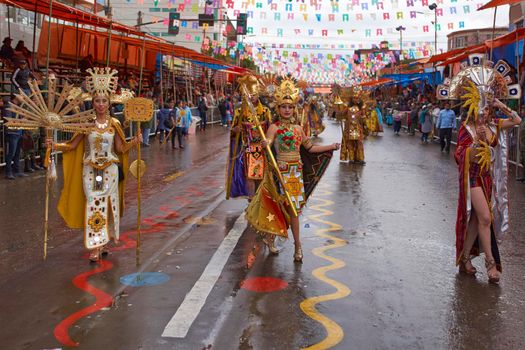 ORURO, BOLIVIA - FEBRUARY 25, 2017: Dancers dressed in ornate Inca style costumes parading through the mining city of Oruro on the Altiplano of Bolivia during the annual carnival.