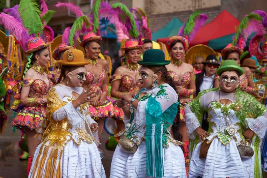 ORURO, BOLIVIA - FEBRUARY 25, 2017: Diablada dancers in ornate costumes parade through the mining city of Oruro on the Altiplano of Bolivia during the annual carnival.