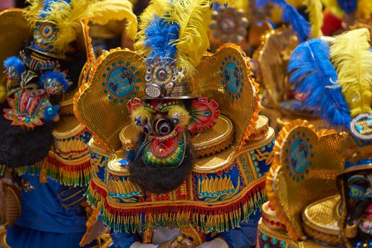 ORURO, BOLIVIA - FEBRUARY 25, 2017: Morenada dancers in ornate costumes parade through the mining city of Oruro on the Altiplano of Bolivia during the annual carnival.