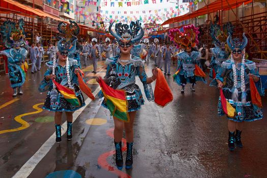 ORURO, BOLIVIA - FEBRUARY 25, 2017: Diablada dancers in ornate costumes parade through the mining city of Oruro on the Altiplano of Bolivia during the annual carnival.