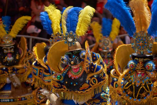 ORURO, BOLIVIA - FEBRUARY 25, 2017: Morenada dancers in ornate costumes parade through the mining city of Oruro on the Altiplano of Bolivia during the annual carnival.