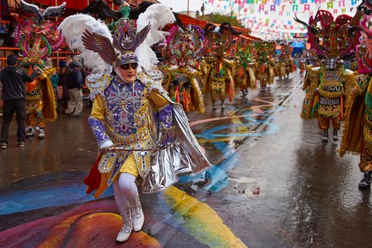 ORURO, BOLIVIA - FEBRUARY 25, 2017: Diablada dancers in ornate costumes parade through the mining city of Oruro on the Altiplano of Bolivia during the annual carnival.