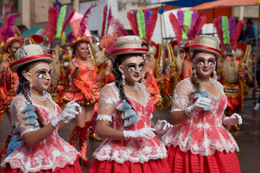 ORURO, BOLIVIA - FEBRUARY 25, 2017: Diablada dancers in ornate costumes parade through the mining city of Oruro on the Altiplano of Bolivia during the annual carnival.