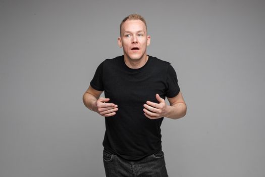 picture of handsome caucasian male explain something isolated on grey background
