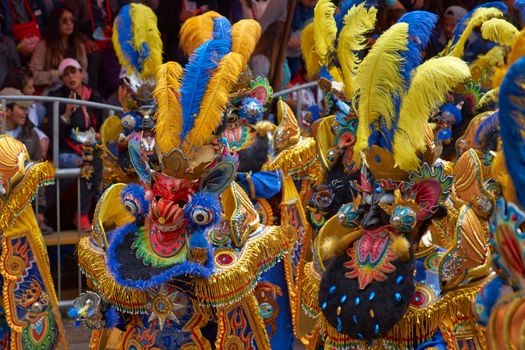 ORURO, BOLIVIA - FEBRUARY 25, 2017: Morenada dancers in ornate costumes parade through the mining city of Oruro on the Altiplano of Bolivia during the annual carnival.