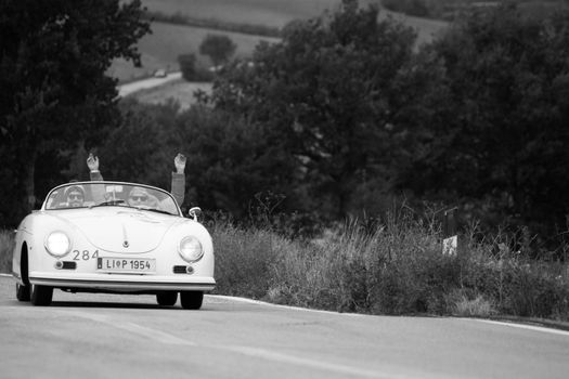 CAGLI , ITALY - OTT 24 - 2020 : PORSCHE 356 SPEEDSTER on an old racing car in rally Mille Miglia 2020 the famous italian historical race (1927-1957)