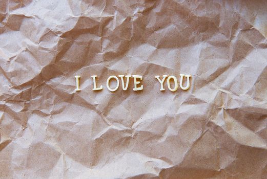 I love you written on kraft paper. valentine card