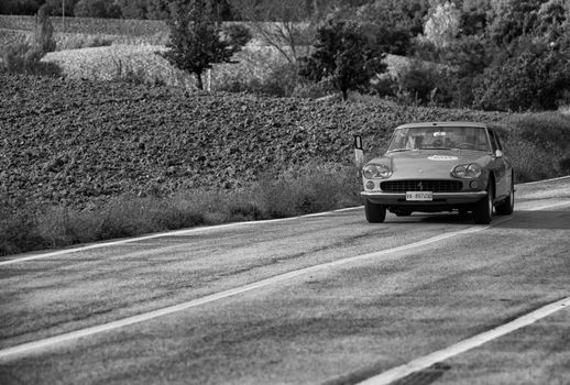 CAGLI , ITALY - OTT 24 - 2020 : FERRARI 330 GT 2+2 on an old racing car in rally Mille Miglia