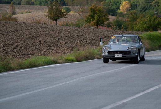 CAGLI , ITALY - OTT 24 - 2020 : FERRARI 330 GT 2+2 on an old racing car in rally Mille Miglia