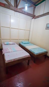 Budget Triple Hostel Room. Two beds. Asian country