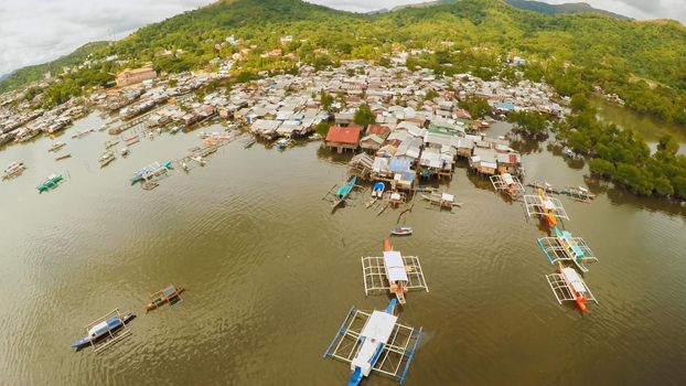 Philippine slums on the beach. Poor area of the city. Coron. Palawan. Philippines