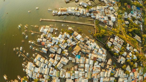 Aerial view Coron city with slums and poor district. Palawan. Busuanga island. Evening time and sunset. Fisheye view