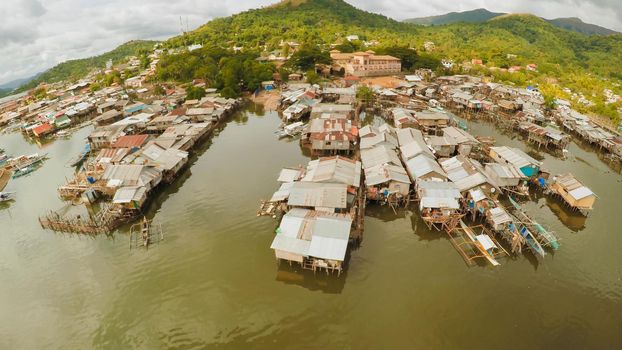 Philippine slums on the beach. Poor area of the city. Coron. Palawan. Philippines