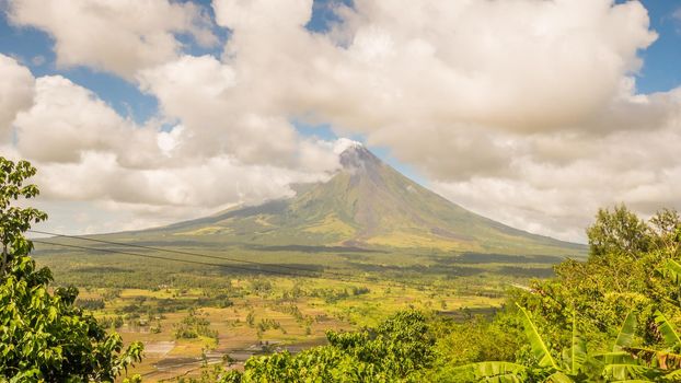 Mayon Volcano in Legazpi, Philippines. Mayon Volcano is an active volcano and rising 2462 meters from the shores of the Gulf of Albay