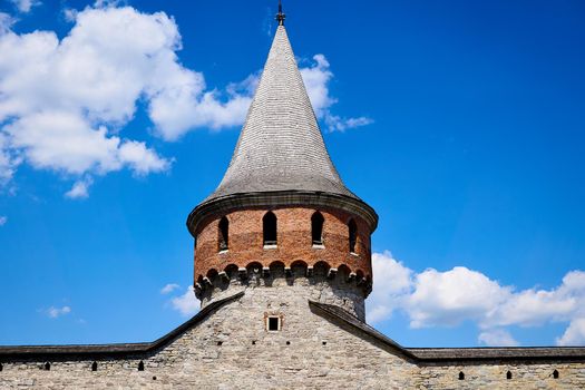 a tower built to create an elevated observation point.Watchtower of the old fortress wall in the summer expanse.