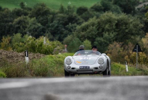 CAGLI , ITALY - OTT 24 - 2020 : PORSCHE 550 SPIDER RS on an old racing car in rally Mille Miglia 2020 the famous italian historical race (1927-1957)