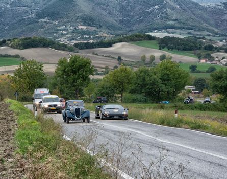 CAGLI , ITALY - OTT 24 - 2020 : FIAT 508 CS BERLINETTA AM LAMBORGHINI DIABLO on an old racing car in rally Mille Miglia 2020 the famous italian historical race (1927-1957)