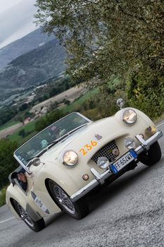 CAGLI , ITALY - OTT 24 - 2020 : TRIUMPH TR 2 SPORTS on an old racing car in rally Mille Miglia 2020 the famous italian historical race (1927-1957)