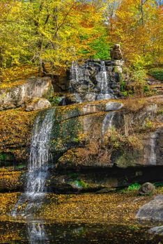 Valley of the Giants and waterfall in the Sofievsky arboretum or Sofiyivsky Park in Uman, Ukraine, on a sunny autumn day